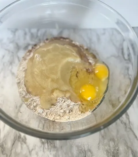 homemade dog treat ingredients in a large mixing bowl